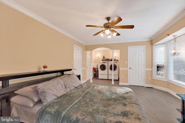 bedroom with washer and clothes dryer, carpet, ceiling fan with notable chandelier, and ornamental molding