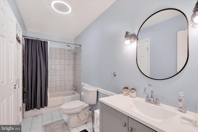 full bathroom featuring tile patterned floors, shower / bath combination with curtain, toilet, and vanity