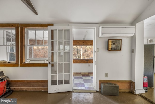 entryway featuring concrete floors and a wall mounted AC