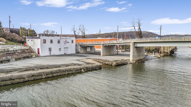 rear view of property with a water view