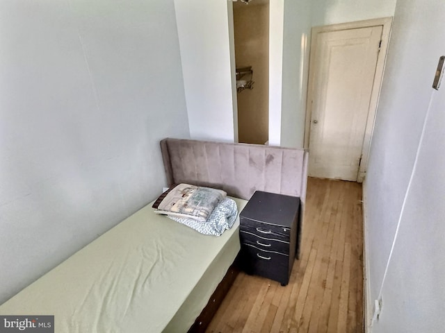 bedroom with hardwood / wood-style floors