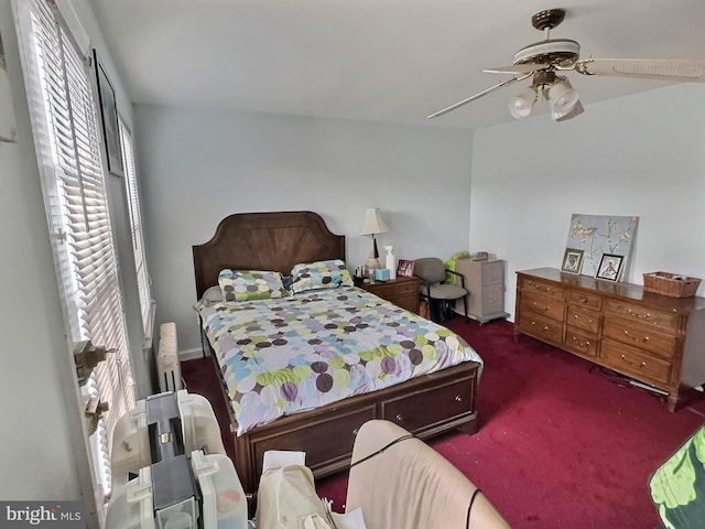 bedroom featuring dark colored carpet and ceiling fan