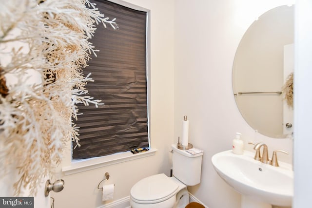 bathroom with sink and toilet