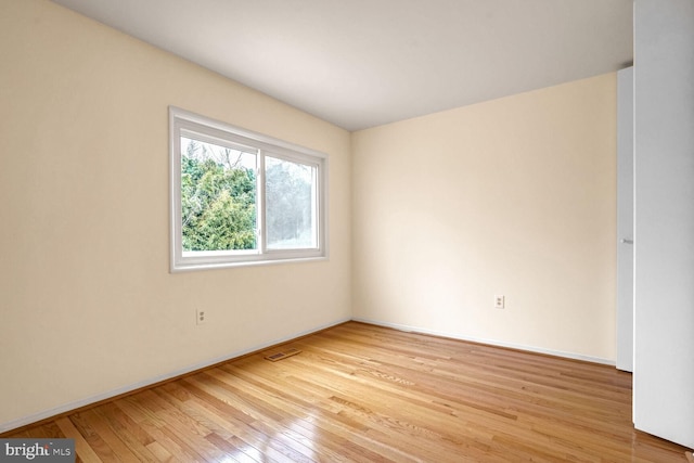 unfurnished room featuring light wood-type flooring