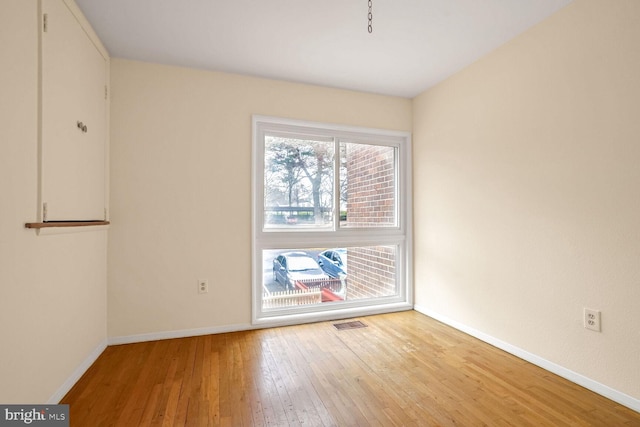 empty room with light wood-type flooring