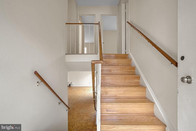 stairway with parquet floors