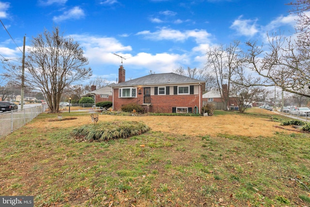 view of side of property featuring a yard