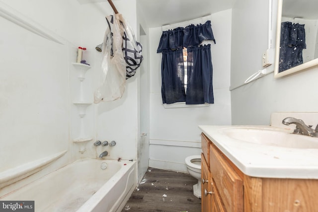 full bathroom with vanity, toilet, wood-type flooring, and bathing tub / shower combination