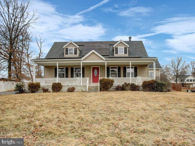 view of front of home featuring covered porch and a front lawn