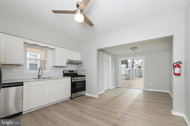 kitchen featuring plenty of natural light, white cabinetry, and appliances with stainless steel finishes