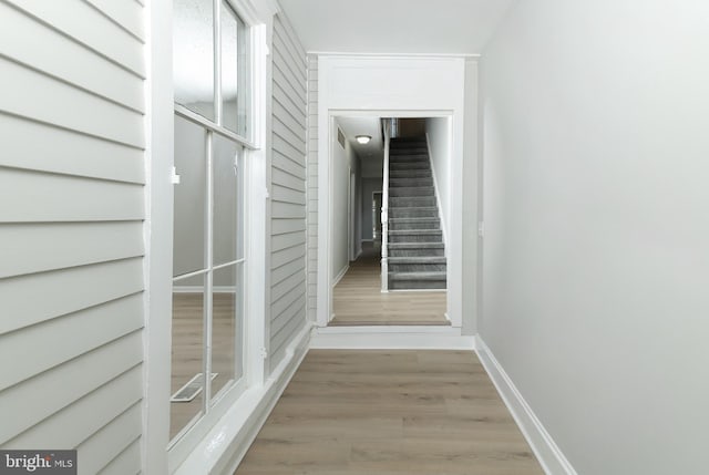 hall with light hardwood / wood-style floors