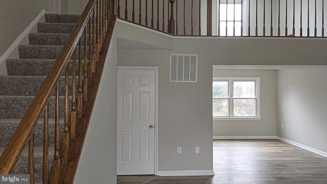 staircase featuring hardwood / wood-style floors