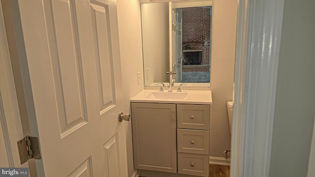 bathroom with vanity and toilet