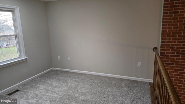 unfurnished room featuring carpet