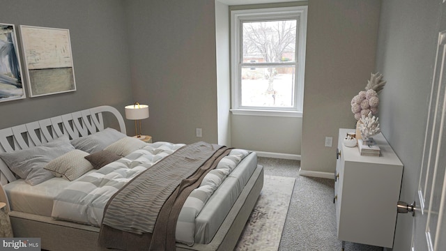 bedroom featuring light colored carpet