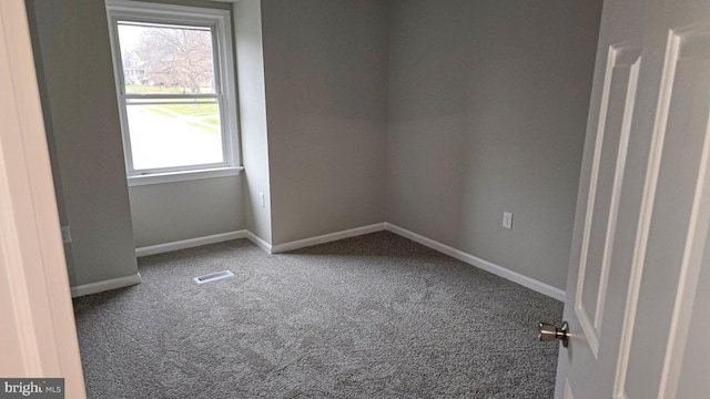 unfurnished room featuring carpet flooring