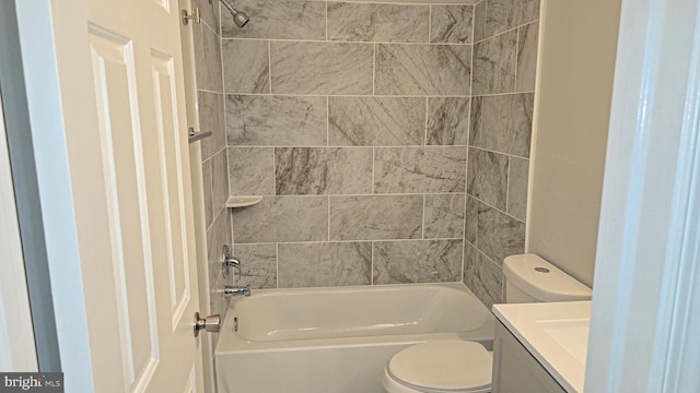 full bathroom featuring vanity, toilet, and tiled shower / bath combo