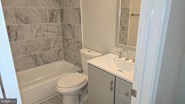 full bathroom with vanity, toilet, and tiled shower / bath