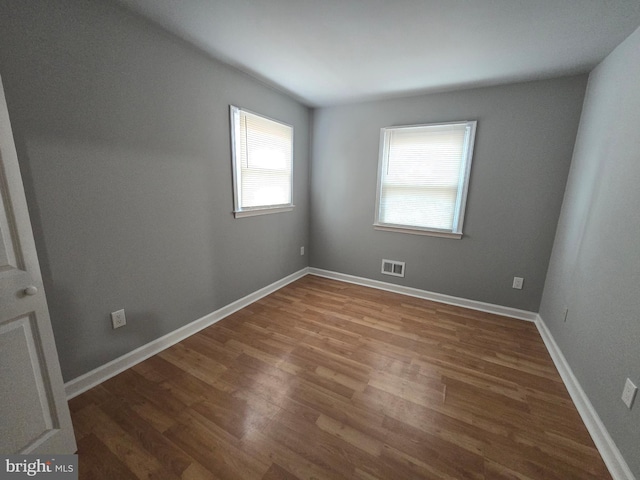 empty room featuring wood-type flooring