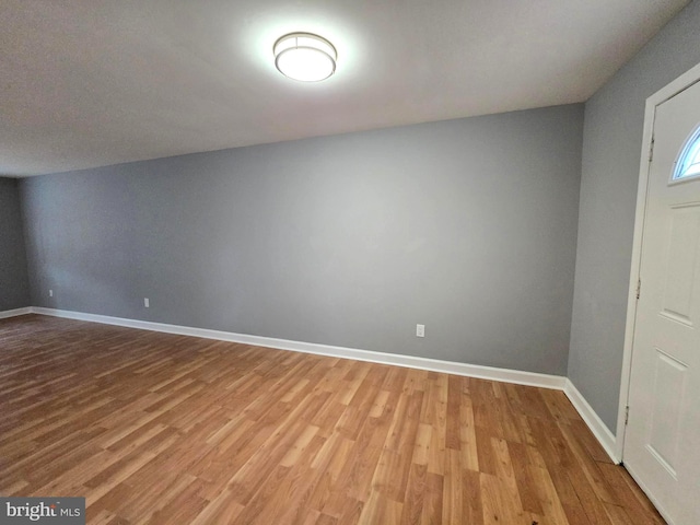 entryway with hardwood / wood-style flooring