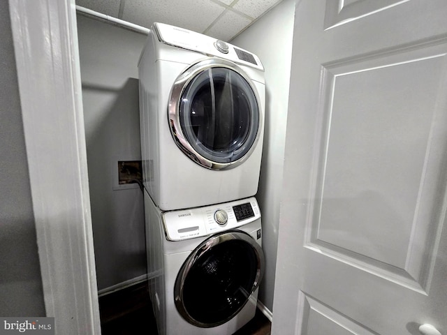 laundry area with stacked washer / drying machine