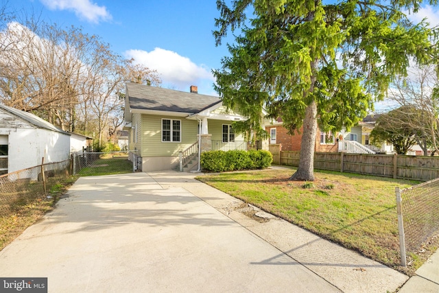 bungalow with a front lawn