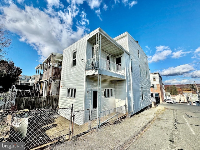 view of property exterior featuring a balcony