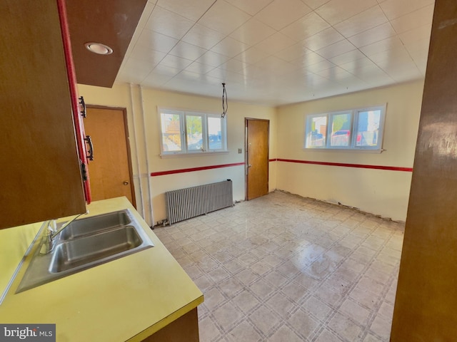 kitchen with radiator heating unit and sink