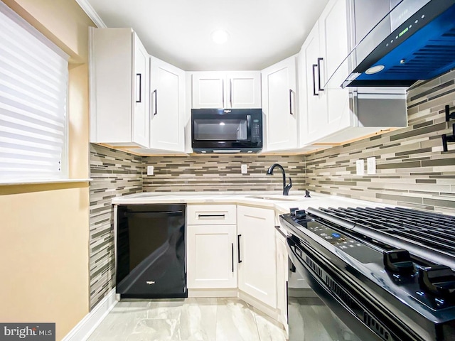 kitchen with white cabinets, exhaust hood, and black appliances