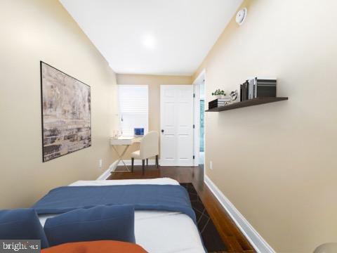 bedroom featuring dark hardwood / wood-style flooring