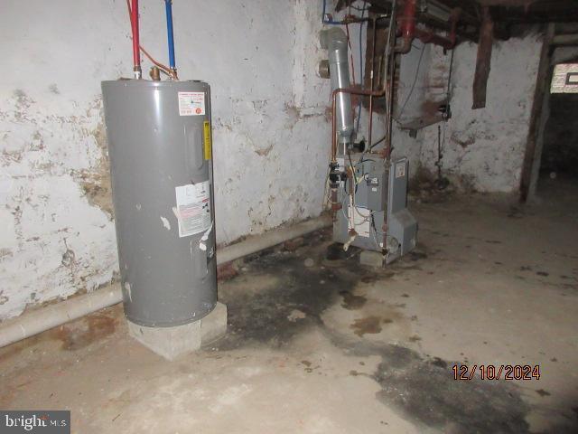 utility room featuring electric water heater