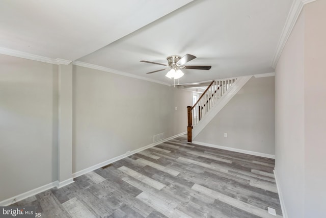 spare room featuring hardwood / wood-style floors, ceiling fan, and ornamental molding