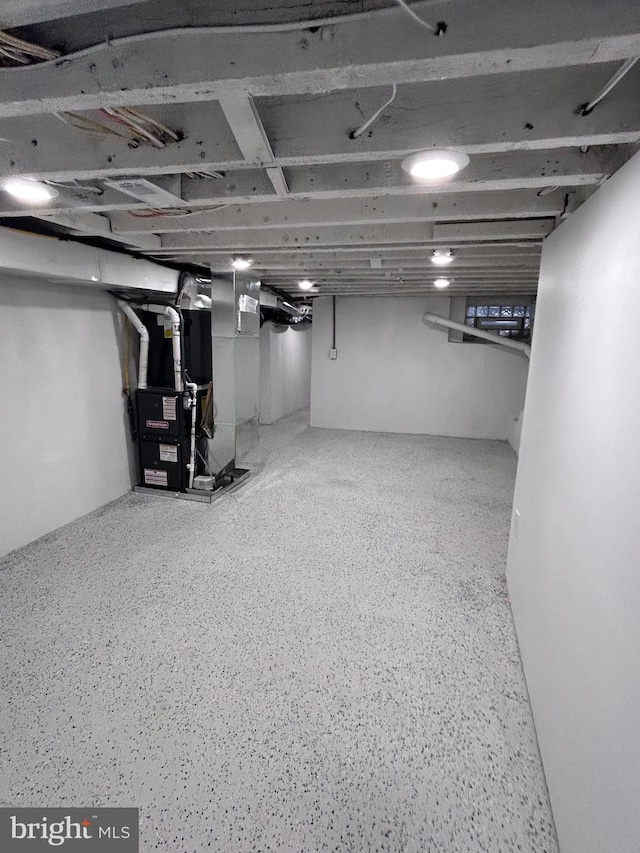 basement featuring heating unit