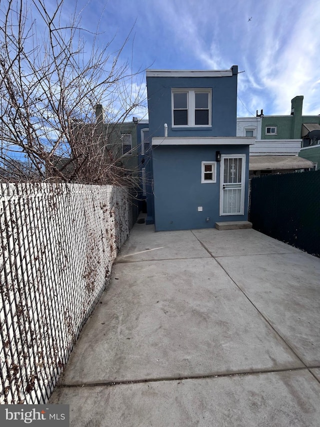 back of property featuring a patio area