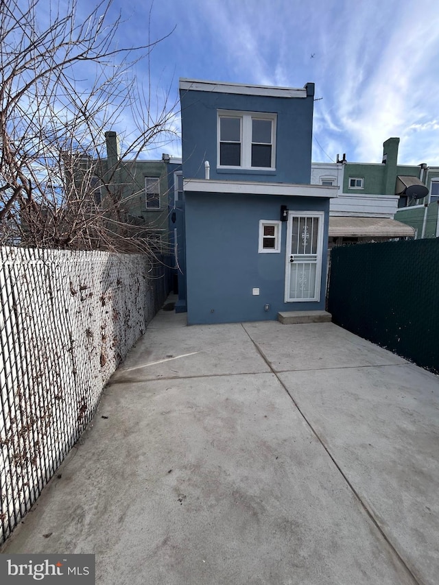 back of house with a patio area