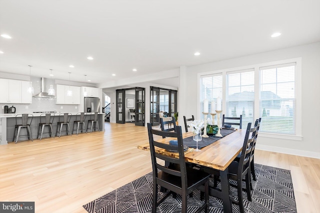 dining area with light hardwood / wood-style floors