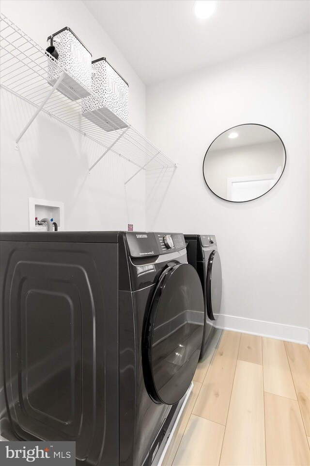 laundry area with washer and clothes dryer