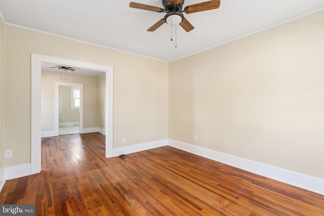 unfurnished room with wood-type flooring, ceiling fan, and crown molding