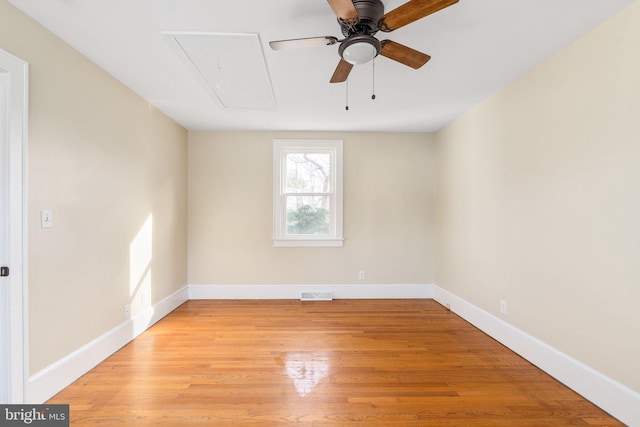 empty room featuring light wood-type flooring and ceiling fan