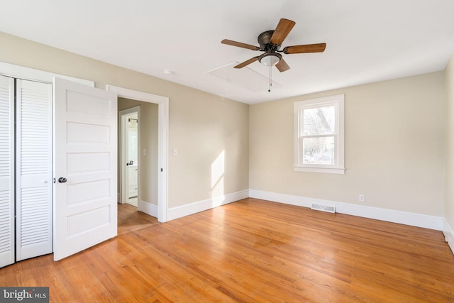 interior space featuring ceiling fan, a closet, and light hardwood / wood-style flooring