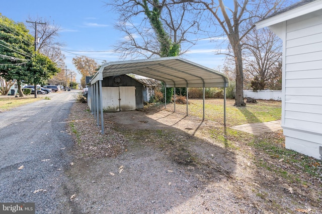 view of vehicle parking featuring a carport