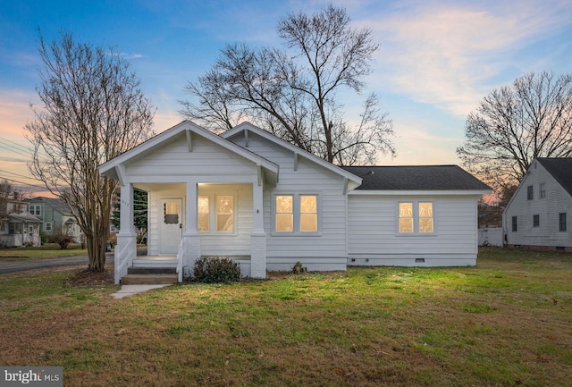 view of front of property with a yard and a porch