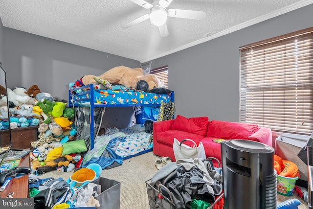 bedroom with ceiling fan, carpet, a textured ceiling, and multiple windows