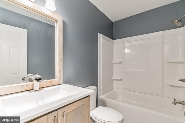 full bathroom with vanity,  shower combination, and toilet