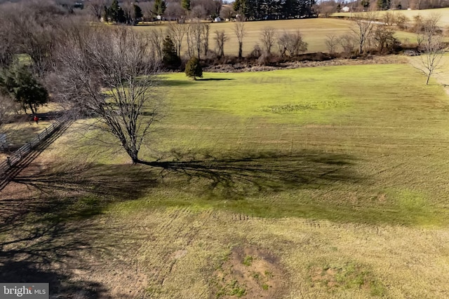 view of yard with a rural view