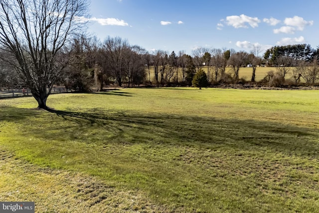 view of yard with a rural view