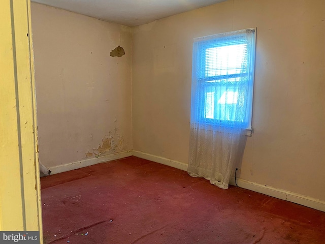 unfurnished room with carpet flooring