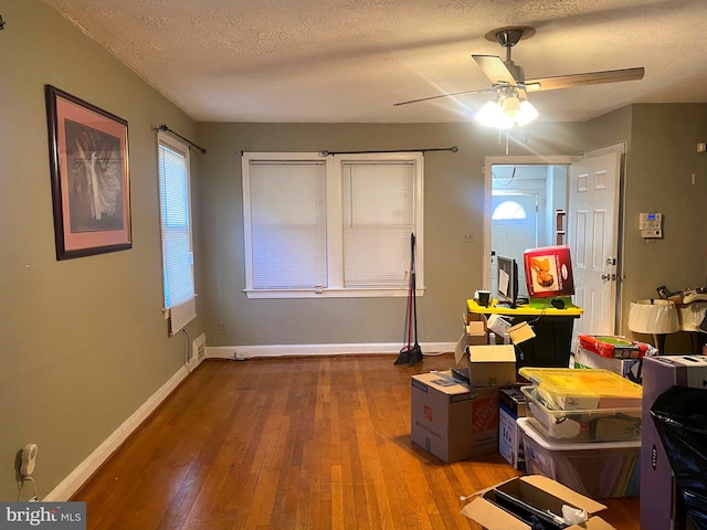 interior space featuring hardwood / wood-style floors, a healthy amount of sunlight, and a textured ceiling