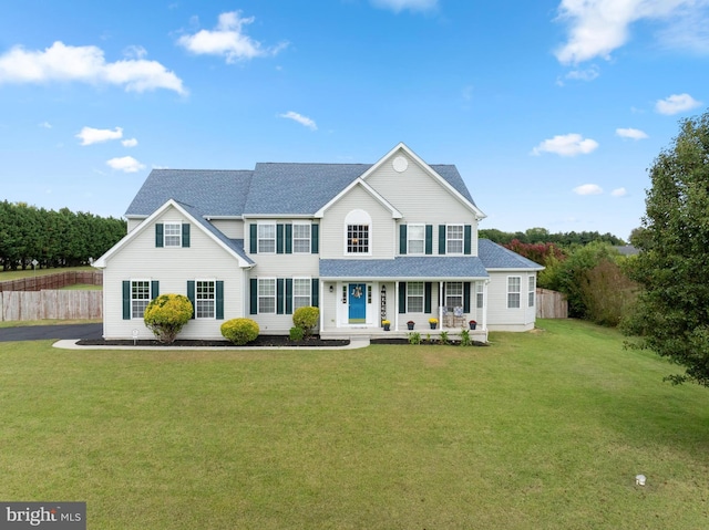 view of front of property with a front yard and a porch