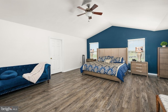 bedroom with lofted ceiling, dark hardwood / wood-style floors, and ceiling fan